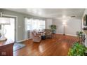 Inviting living room with hardwood floors, large windows, and comfortable seating arrangement at 45 Kirk E Dr, Indianapolis, IN 46234