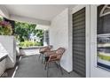 Cozy front porch featuring brick accents and inviting outdoor seating at 4721 Carrollton Ave, Indianapolis, IN 46205