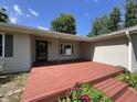 Spacious wooden deck perfect for outdoor entertaining, with beautiful flower boxes and a stylish entrance at 6238 E Southport Rd, Indianapolis, IN 46237