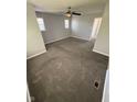 Cozy bedroom featuring plush carpeting, neutral paint, and plenty of natural light for a relaxing atmosphere at 6504 Potomac Square Ln, Indianapolis, IN 46268