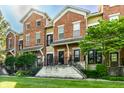Brick townhouses featuring well-maintained exteriors and appealing landscaping at 6592 Reserve Dr, Indianapolis, IN 46220