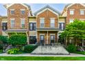 Charming brick townhouses with a manicured lawn and inviting entrance at 6592 Reserve Dr, Indianapolis, IN 46220