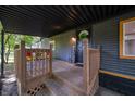 Inviting front porch with wooden railings and a 'Welcome' sign, creating a warm entrance at 71 E Cove Ct, Cicero, IN 46034
