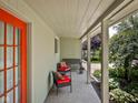 Charming covered patio perfect for outdoor lounging with comfortable seating and lush greenery at 7401 N Layman Ave, Indianapolis, IN 46250