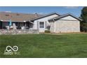 This property boasts a well-maintained lawn and unique stone features at 1001 Paradise Ct # F, Greenwood, IN 46143