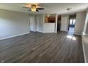 Spacious living room with modern flooring and ample natural light, creating a comfortable and inviting atmosphere at 10891 Sweetsen Rd, Camby, IN 46113