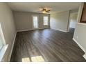 Spacious living room with modern flooring and ample natural light, creating a comfortable and inviting atmosphere at 10891 Sweetsen Rd, Camby, IN 46113