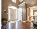 Welcoming foyer with hardwood floors, high ceilings, and a view into other living spaces at 11350 Old Stone Dr, Indianapolis, IN 46236