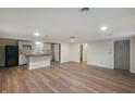 Open kitchen features white cabinetry, an island with wood countertop, and stainless steel appliances at 2009 N New York Ave, Muncie, IN 47304