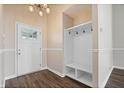 A welcoming entryway with a convenient mudroom, featuring hooks and storage for organization at 216 Haywood Rd, Greenwood, IN 46142