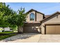 Charming two-story home with a well-manicured lawn and an attached two-car garage at 2247 Frisco Pl, Indianapolis, IN 46240