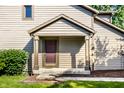 Inviting front porch with a charming entrance and a well-kept lawn at 2247 Frisco Pl, Indianapolis, IN 46240