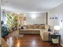 Spacious living room with hardwood floors, neutral paint, and a large comfortable sectional at 2355 Collins Way, Greenfield, IN 46140