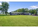 Well maintained one-story home with large front yard, detached garage and mature trees at 2911 N 200 W Rd, Franklin, IN 46131