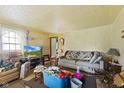 Cozy living room featuring comfortable seating and a large window for natural light at 3304 Coffey St, Indianapolis, IN 46217