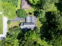 An aerial view of a charming home with an attached garage and mature trees at 5631 Shelby St, Indianapolis, IN 46227
