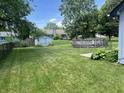 Spacious backyard featuring an above-ground pool, storage shed, and ample green space for recreation at 6932 Deerbrook Ct, Indianapolis, IN 46214