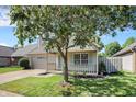 Charming single-story home boasts an attached garage, covered front porch, and well-maintained lawn at 9936 Waterside Dr, Noblesville, IN 46060