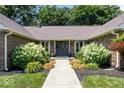 Inviting front entrance with a well-manicured landscape leading to a stylish front door at 12674 Banbury Cir, Carmel, IN 46033