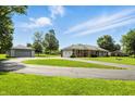 Well-maintained brick home with detached garage and spacious circular driveway at 1981 N Valley Ln, Greenfield, IN 46140