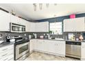 Cozy kitchen features white cabinets, stainless steel appliances, and backsplash at 2029 Seven Peaks Dr, Cicero, IN 46034