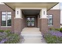 Inviting front entrance featuring double doors with decorative wreaths and manicured landscaping at 20450 Chatham Hills Blvd, Westfield, IN 46074