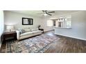 Bright living room featuring an open layout, stylish rug, and view of the kitchen at 2563 Harlan St, Indianapolis, IN 46203