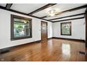 Bright living room featuring hardwood floors, decorative trim and ceiling beams at 39 N Bosart N Ave, Indianapolis, IN 46201