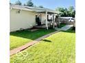 Backyard featuring a covered patio, with space for entertaining or relaxing at 409 N Kyle St, Edinburgh, IN 46124