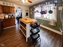 Bright kitchen with wooden cabinets, central island, and lots of storage space at 430 W Locust St, Shelbyville, IN 46176