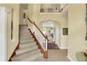 Grand foyer with staircase, neutral paint, tile floor and an open floorplan at 4704 Pearcrest Way, Greenwood, IN 46143