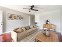 Bright living room features hardwood floors, comfortable seating, and stylish decor at 4904 E 14Th St, Indianapolis, IN 46201