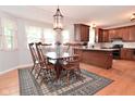 Traditional dining room featuring wooden table, hardwood floors, and natural light at 6118 Yellow Birch Ct, Avon, IN 46123