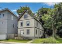 Charming two-story home featuring updated siding, front porch and manicured front lawn at 629 E 25Th St, Indianapolis, IN 46205