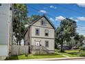 Charming two-story home featuring updated siding, front porch and manicured front lawn at 629 E 25Th St, Indianapolis, IN 46205