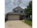 Charming two-story home with a brick and vinyl exterior, attached two-car garage and covered front porch at 6632 Coppel Ct, Indianapolis, IN 46259