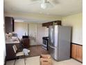This kitchen boasts a new stainless steel refrigerator, range and updated cabinet hardware at 9842 N State Road 9, Pendleton, IN 46064