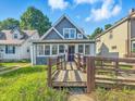 Charming home featuring a spacious front yard and covered porch at 1016 W 31St St, Indianapolis, IN 46208