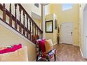 Welcoming foyer with hardwood floors, high ceilings, and a staircase at 10611 Armstead Ave, Indianapolis, IN 46234