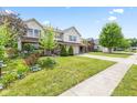 Beautiful two-story home with a well-maintained lawn and landscaping at 10611 Armstead Ave, Indianapolis, IN 46234