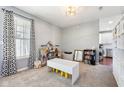 Bright playroom with large window, play furniture, and plenty of natural light at 12404 Guy Way, Indianapolis, IN 46236