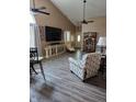 Inviting living room with vaulted ceiling, new floors, lots of light and ceiling fans at 1311 Flintlock Dr, Greenwood, IN 46143