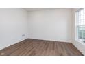 A bright, empty bedroom with hardwood floors and large windows is ready for customization at 14514 Hanford Ln, Carmel, IN 46074