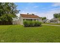 Charming single-story house featuring a well-manicured lawn and inviting curb appeal at 1730 S State Ave, Indianapolis, IN 46203