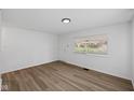 Neutral living area with hardwood floors, fresh paint, and natural light at 1730 S State Ave, Indianapolis, IN 46203