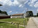 Detached one-car garage on a grassy lot with clear sky in the background at 1902 Westview Dr, Indianapolis, IN 46221