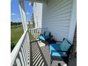 Relaxing back porch with outdoor seating overlooking the landscaped yard and pond at 2485 Blue Ridge Dr, Greenwood, IN 46143