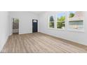 Inviting living room featuring hardwood floors, ample natural light, and neutral paint at 2709 Station St, Indianapolis, IN 46218