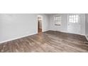 Bright living room showcasing the hardwood floors and a fresh coat of paint at 319 S Webster Ave, Indianapolis, IN 46219