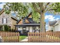 Attractive house with a lovely yard and mature trees, offering a serene and inviting outdoor space at 44 S Tremont St, Indianapolis, IN 46222